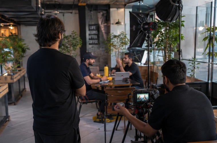Hivex production crew reviewing footage on location in Dubai